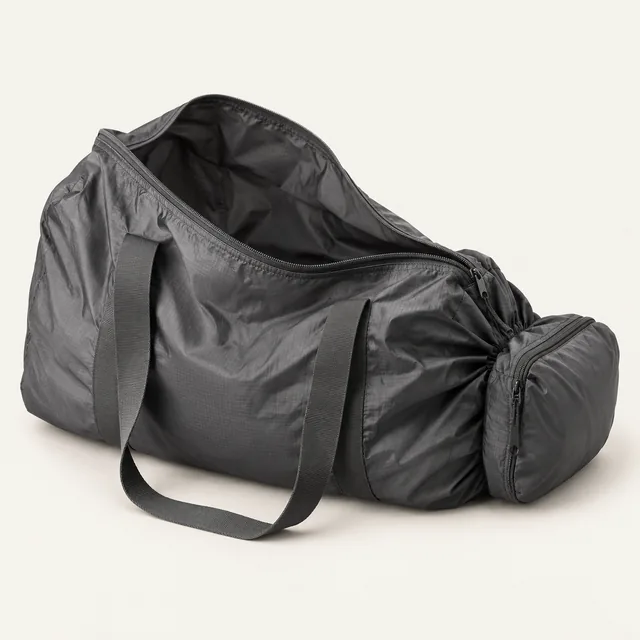 AI-generated illustration of packable household duffel; representative equipment type, not a specific product