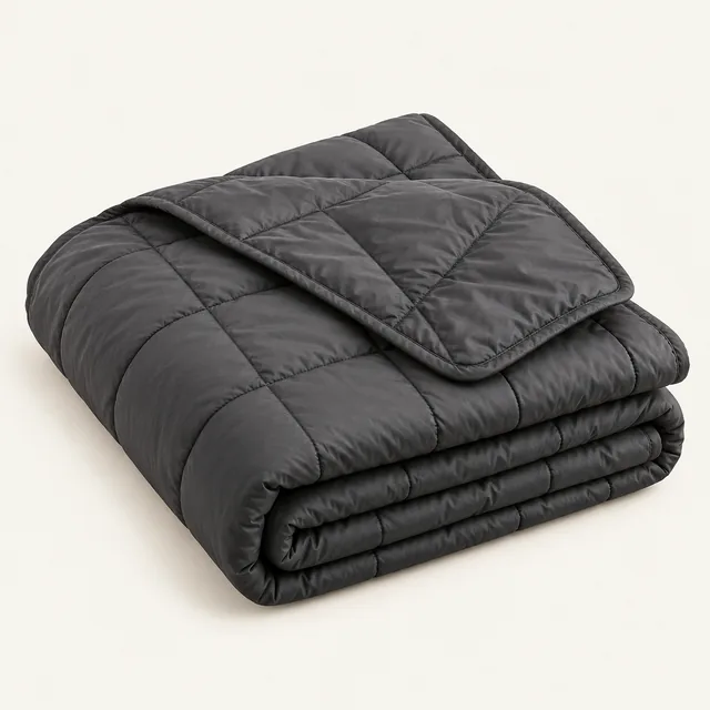 AI-generated illustration of packable insulated blanket; representative equipment type, not a specific product